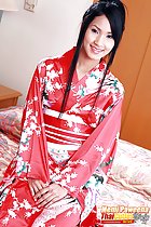 Seated in kimono hands clasped