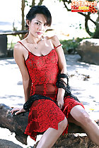 Soda Nuch seated wearing red dress